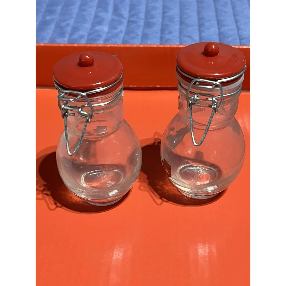 Set of 2 Snowman Glass Canisters with Red Lids. One Missing The Plastic Joint